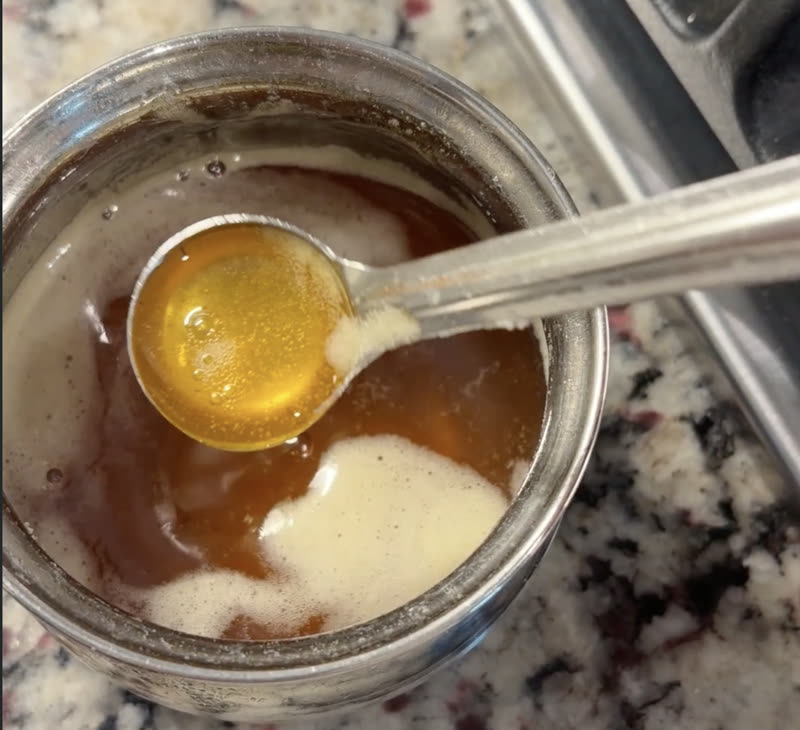 Finished ghee strained into a clean glass jar